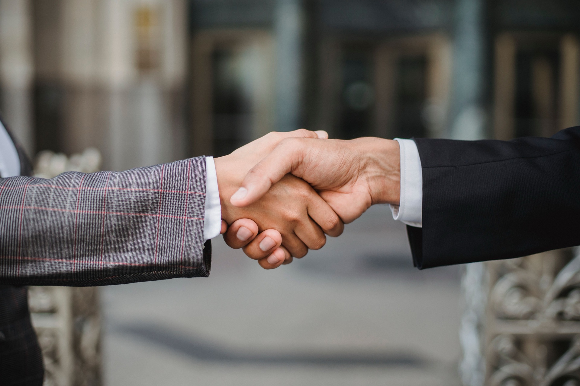 Business partners joining hands in agreement